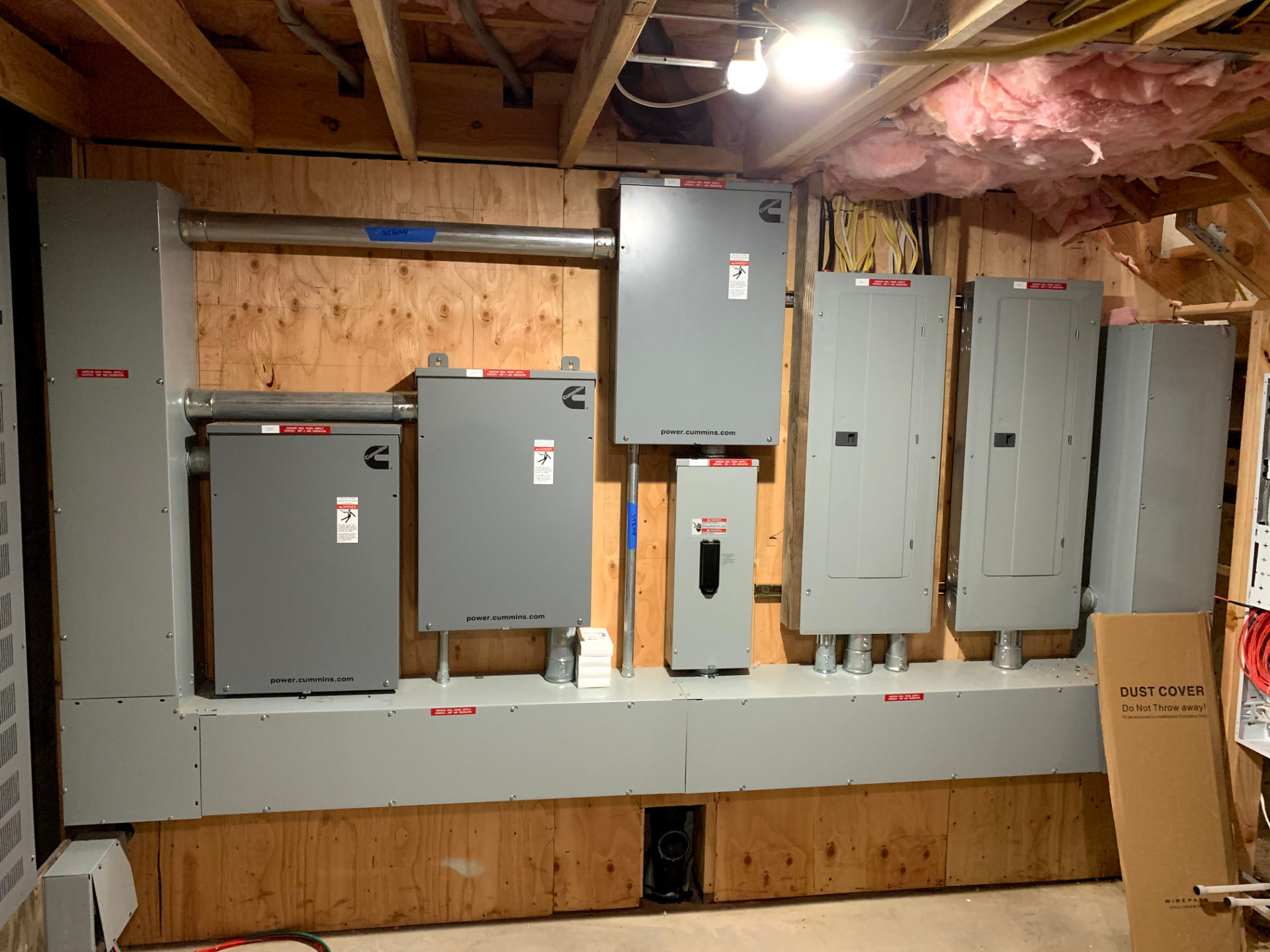 Generator control panels and transfer switches in a utility room