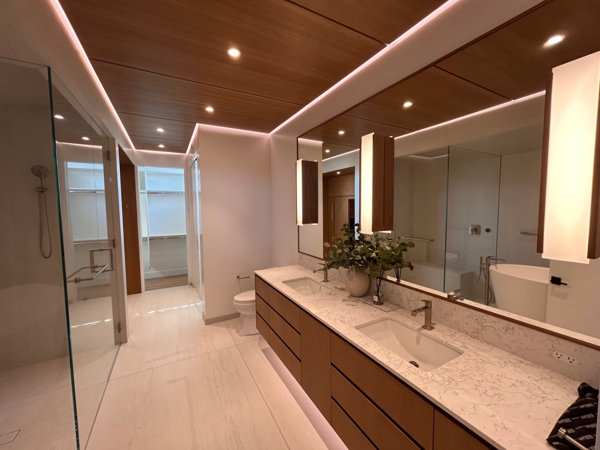 Modern bathroom and vanity with layered lighting
