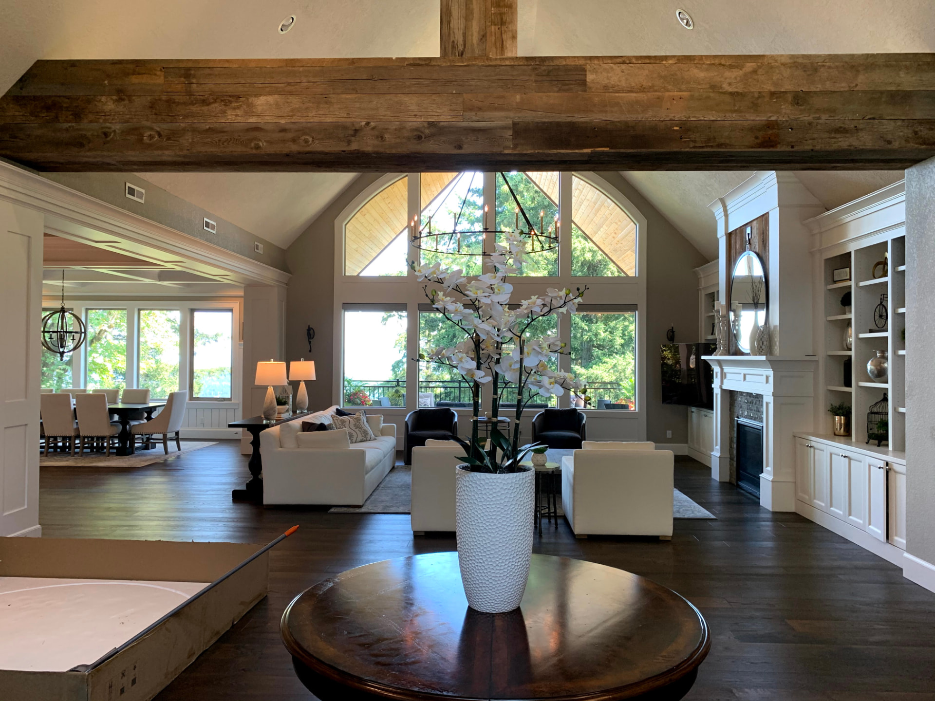Luxurious living room with tall windows and chandelier